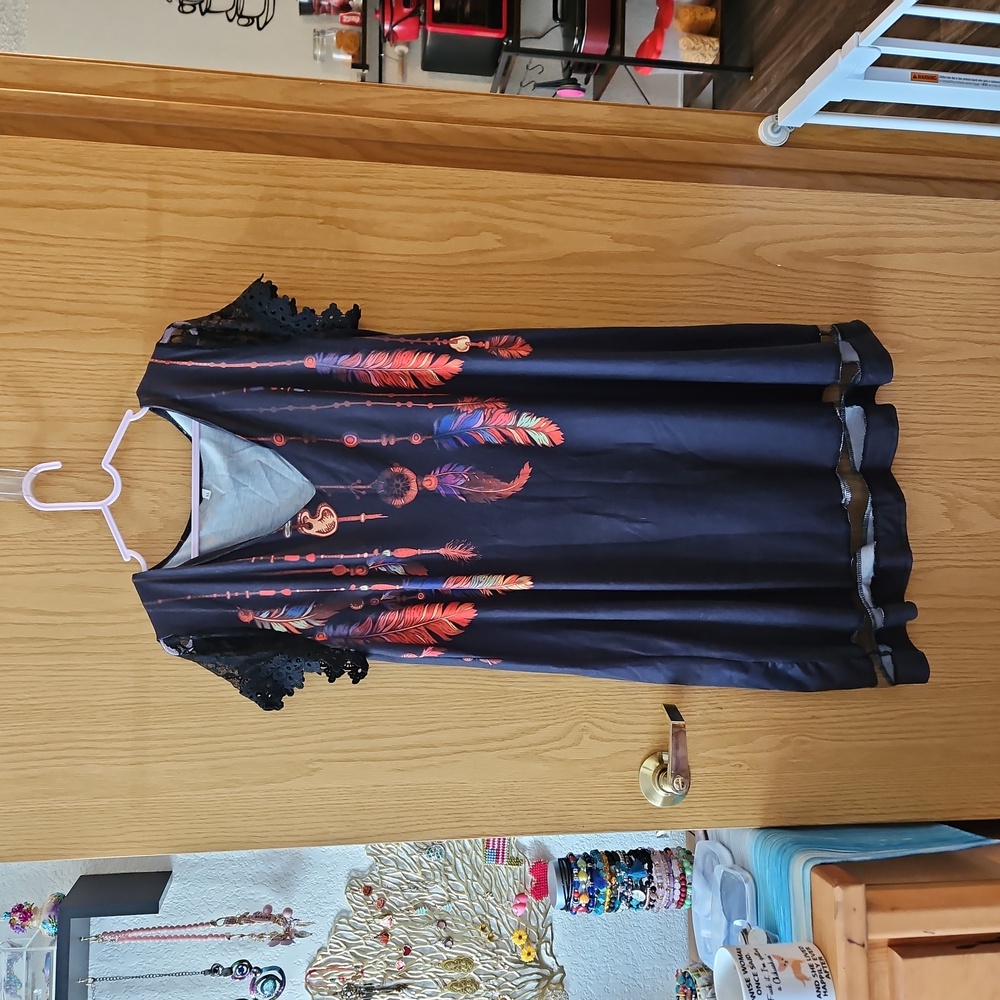 Black dress with feather design